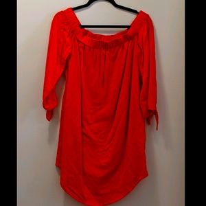 Orange off the shoulder dress.